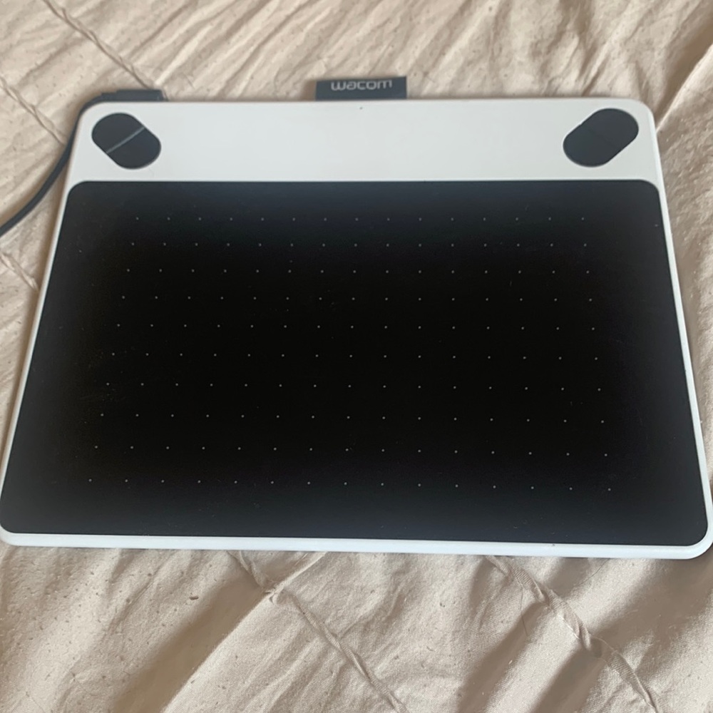 Wacom: comes with cable and pen as well as extra tips inside